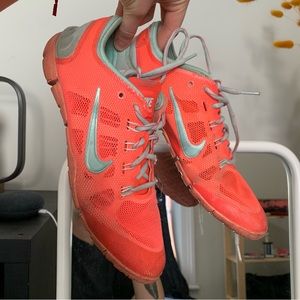 pink and teal nike training shoes